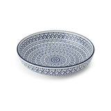 Ceramic bowl with blue geometric pattern on a white background