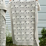 Cotton Baby blanket in a soft grey colour with white sheep and black faces
