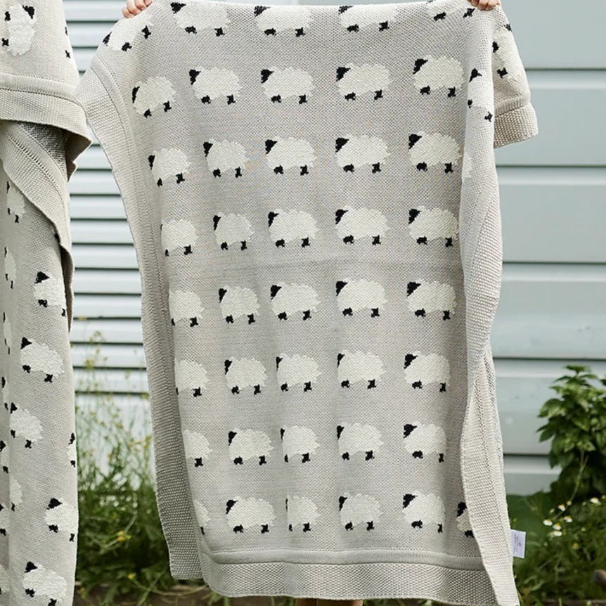 Cotton Baby blanket in a soft grey colour with white sheep and black faces