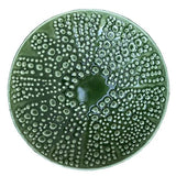 Green kina ceramic bowl with bubble pattern on a white background