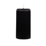 Black ribbed wax candle with LED flame