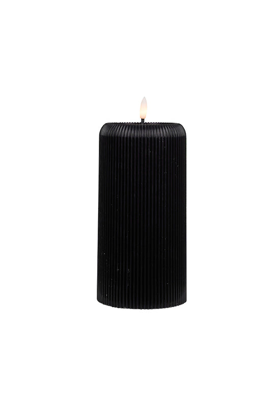 Black ribbed wax candle with LED flame