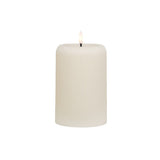 Small cream ribbed wax candle with LED flame