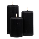 Set of 3 different height black ribbed candles with LED flame