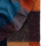 Westport woolen throw incolours of marigold, blue and burnt orange with tassels