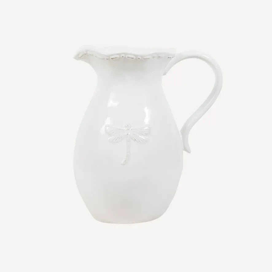 White ceramic jug with embossed dragonfly on the front
