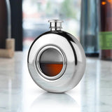 The Viski Scope Hip Flask features a glass porthole window allowing you to keep an eye on your liquor level so you will always know when you need to refill. Made from stainless steel and holds 5 oz. Stainless Steel.