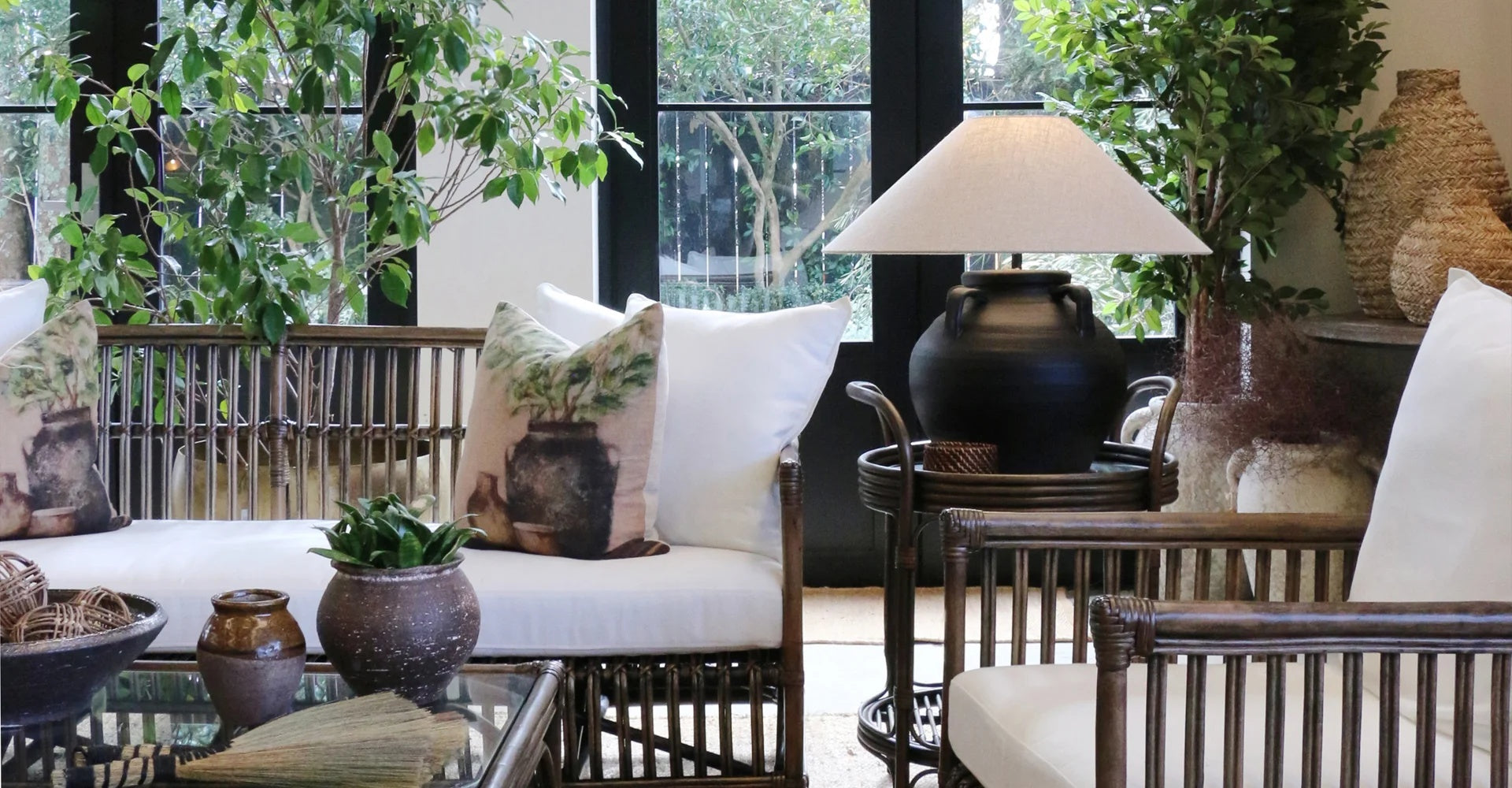 CC Interiors showroom with styled display of rattan seating, lamps, vases and cushions