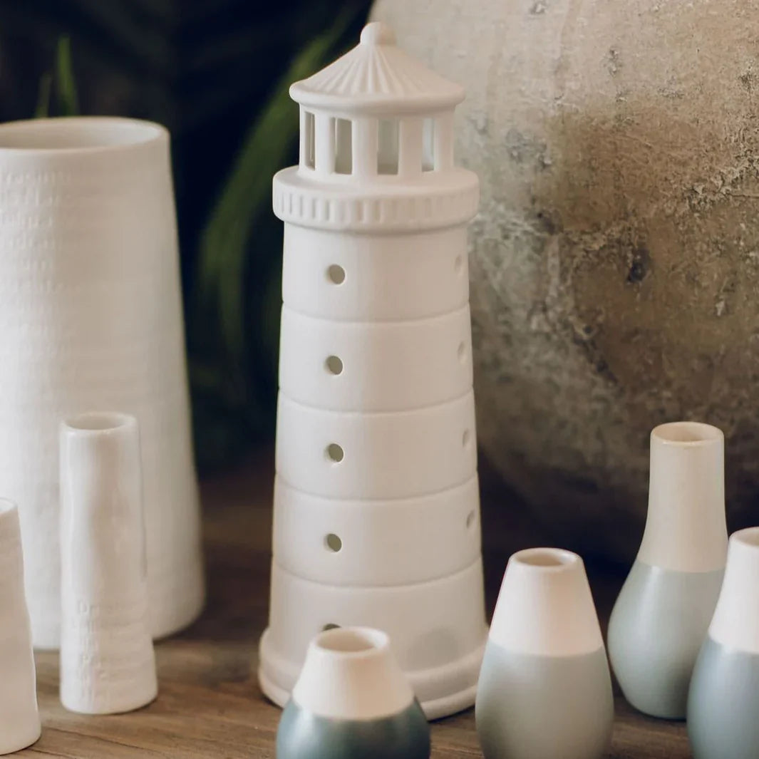 Collection of Radar porcelain products including vases and tealight lighthouse at Cerise in Blenheim NZ.