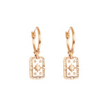 Gold hoop earrings with star designs on a white background
