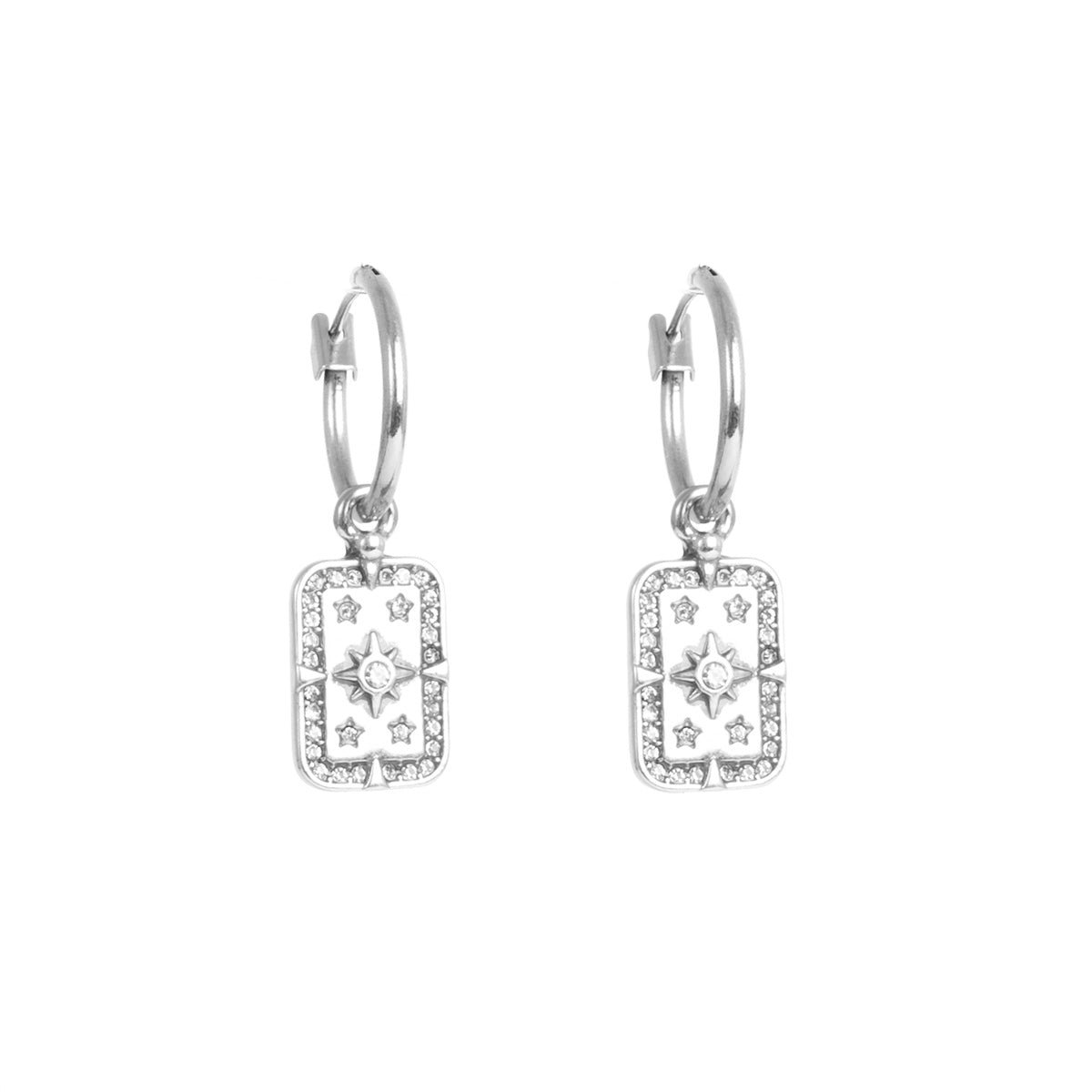 Silver earrings with star designs on a white background