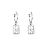 Silver earrings with star designs on a white background