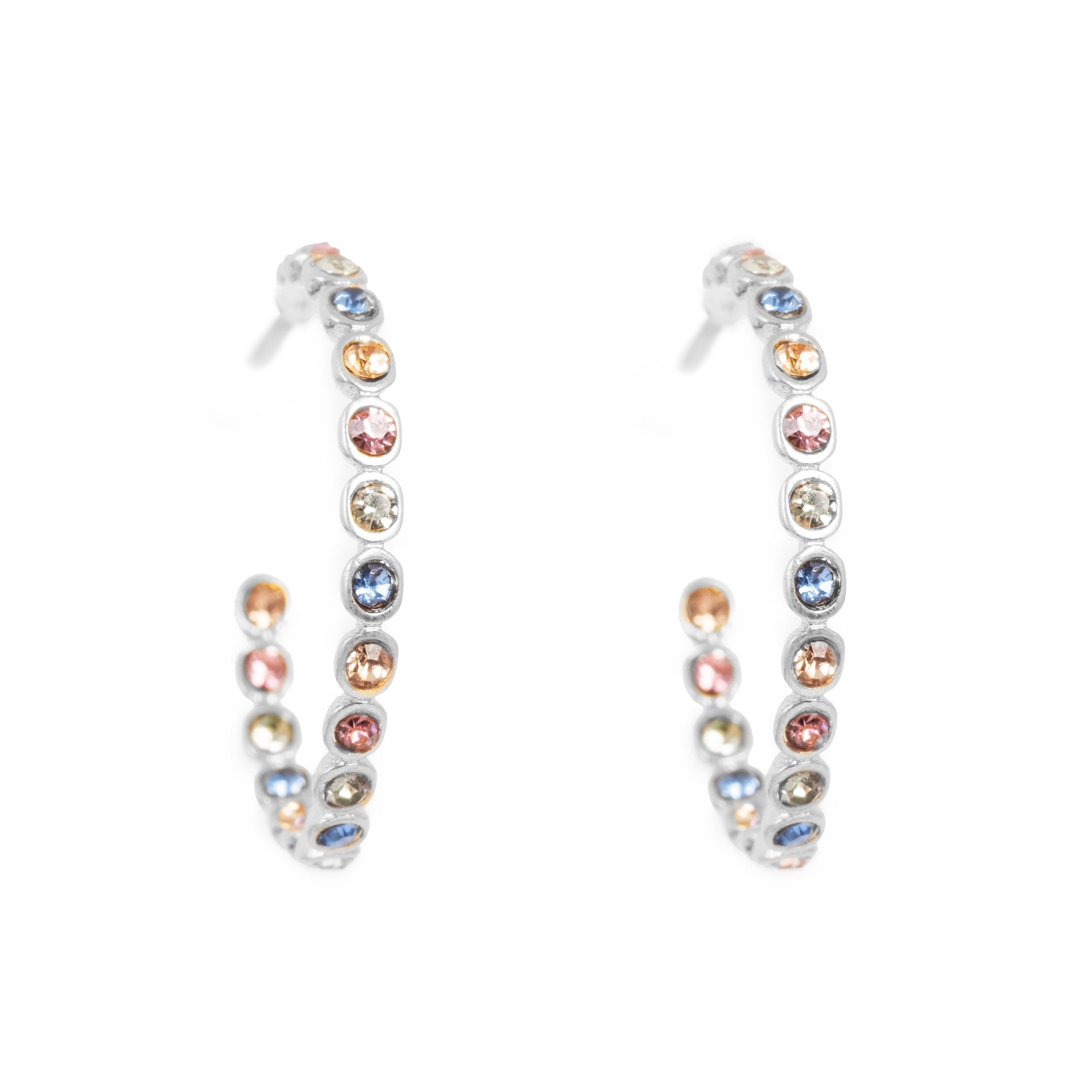Pair of hoop earrings with multicolored gemstones on a white background