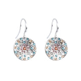 Silver earrings with multicolored crystals on a white background