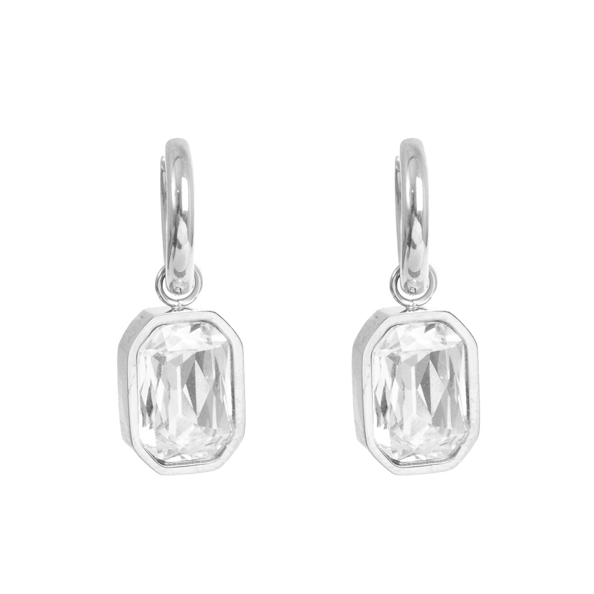 Pair of silver earrings with clear crystals on a white background