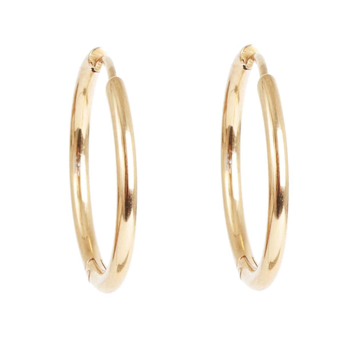 Gold hoop earrings on a white background