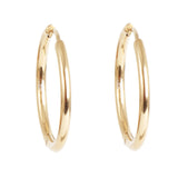 Gold hoop earrings on a white background