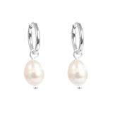 Pair of pearl hoop earrings on a white background