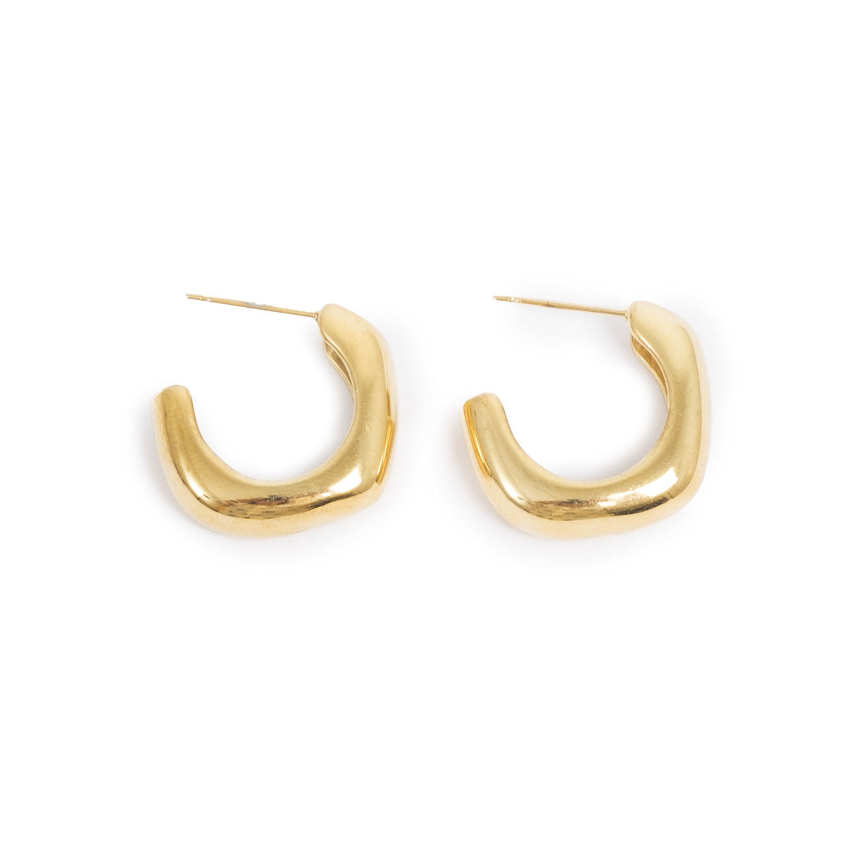 Gold hoop earrings on a white background