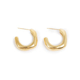Gold hoop earrings on a white background
