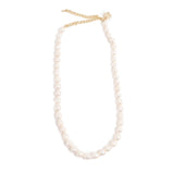 Pearl necklace with gold clasp on a white background