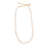 Pearl necklace with gold clasp on a white background