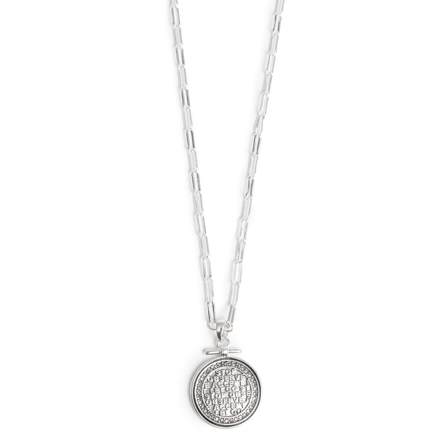 Silver pendant disc with script and crystals