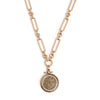 Gold chain necklace with a round pendant on a white background
