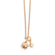 Gold necklace with a pendant on a white background