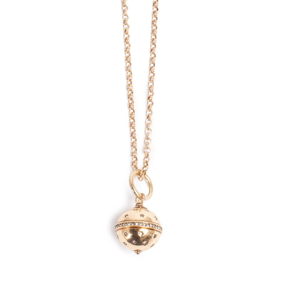 Gold necklace with a spherical pendant on a white background