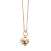 Gold necklace with a spherical pendant on a white background