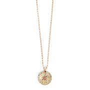 Gold necklace with a round pendant featuring coloured crysals on a white background