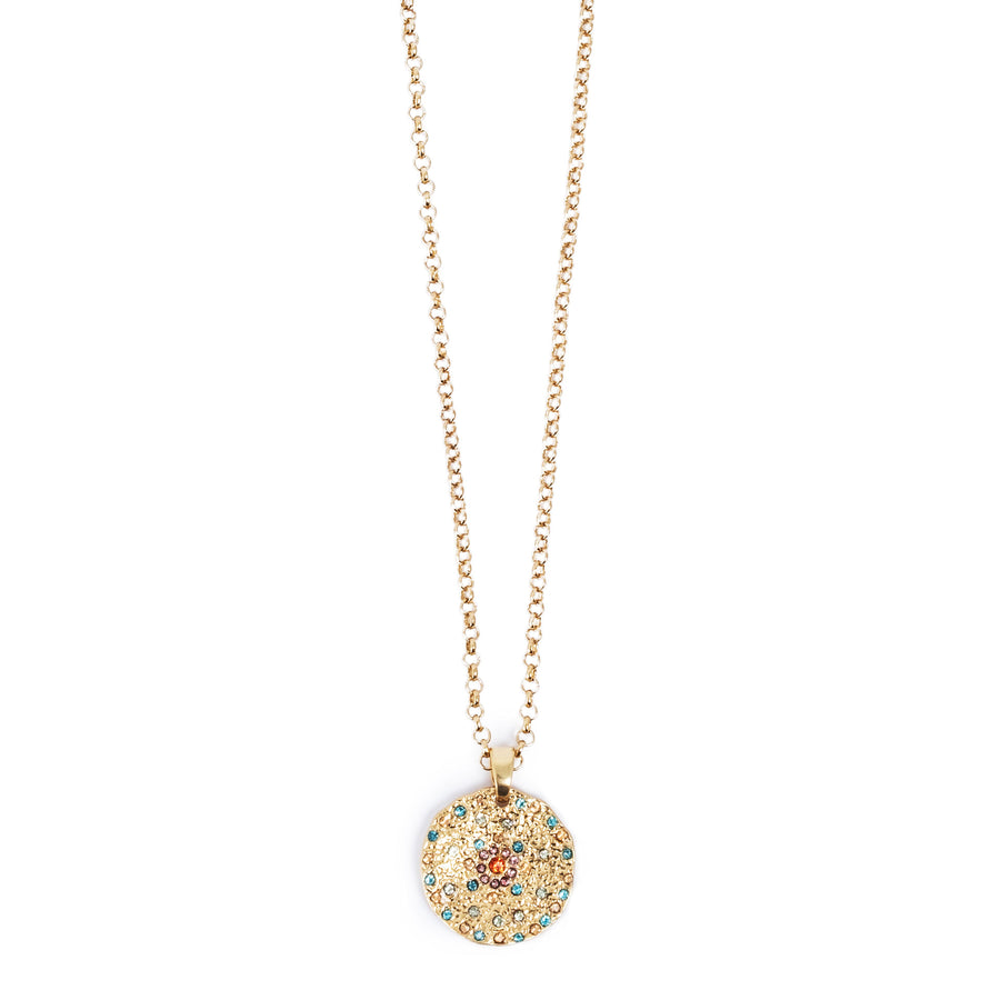 Gold necklace with a round pendant featuring coloured crysals on a white background