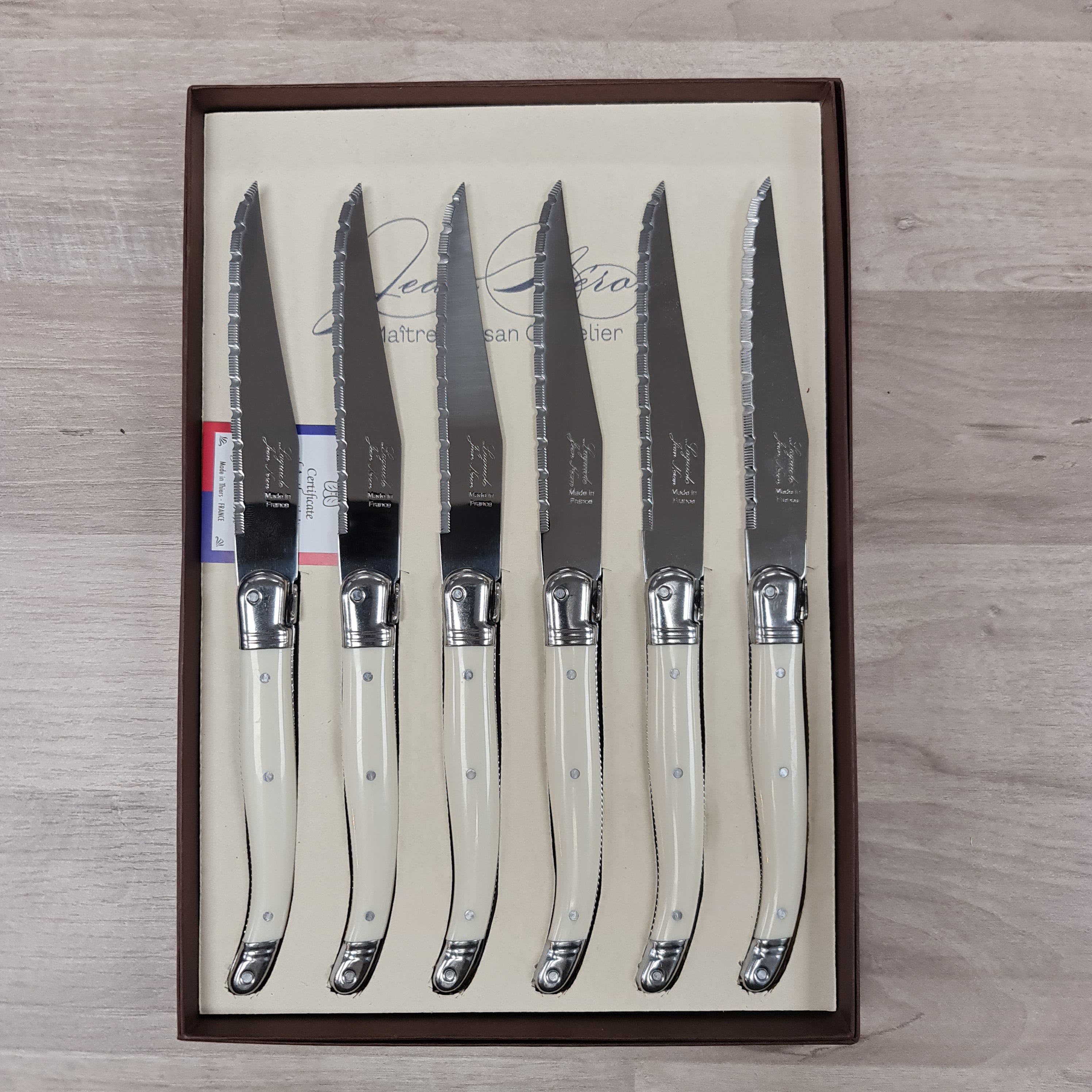 Set of 6 Ivory coloured handle steak knives with bee