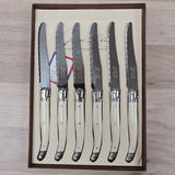 ivory handled table knives with bee icon