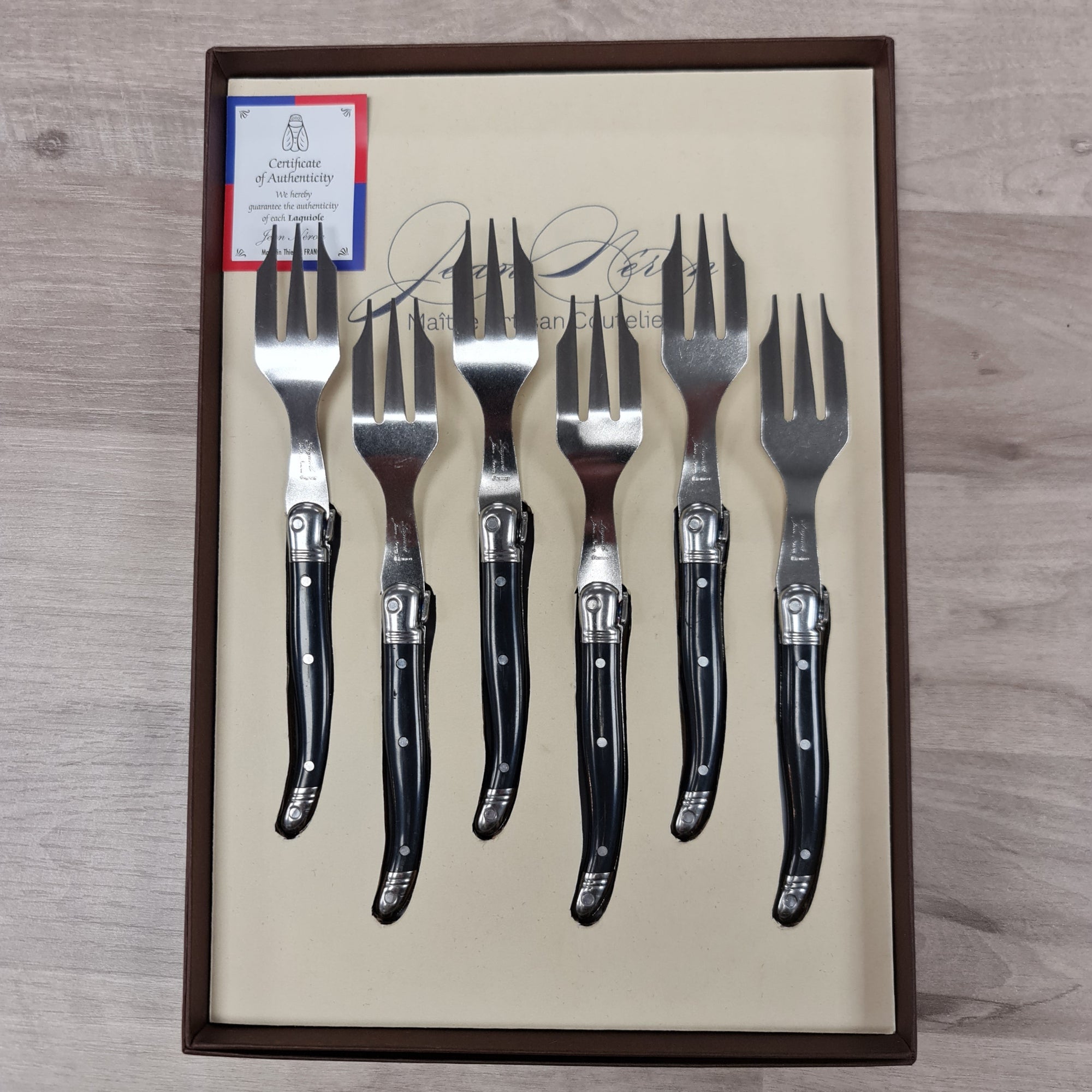 Black handled laguiole desert cake forks with bee icon in a gift set of 6