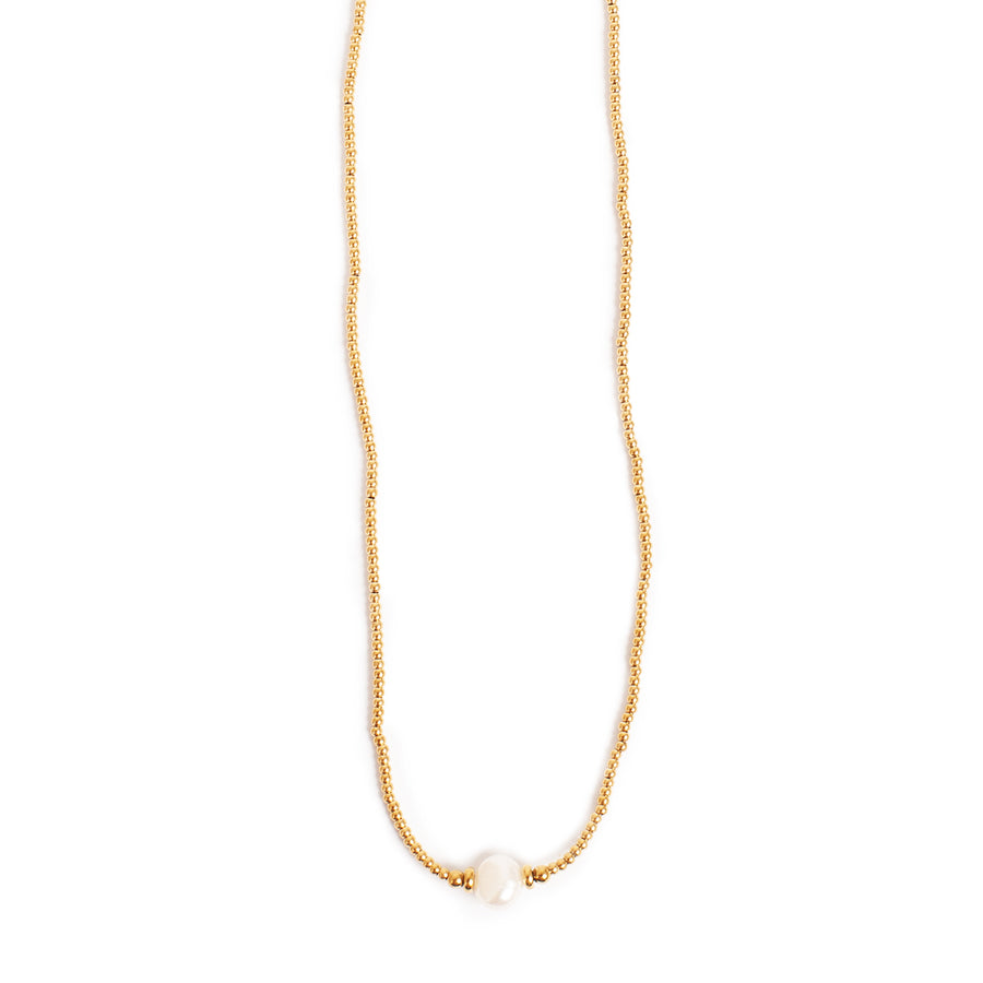 Gold necklace with a single pearl on a white background