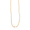 Gold necklace with a single pearl on a white background