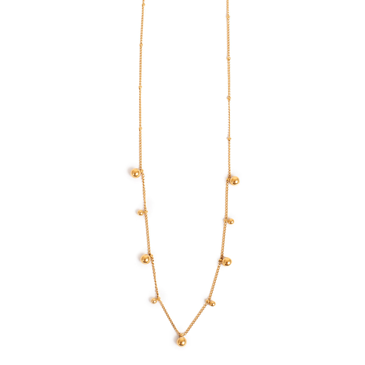 Gold necklace with small balls on a white background