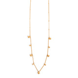 Gold necklace with small balls on a white background