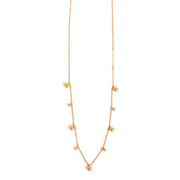 Gold necklace with small balls on a white background