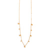 Gold necklace with small balls on a white background