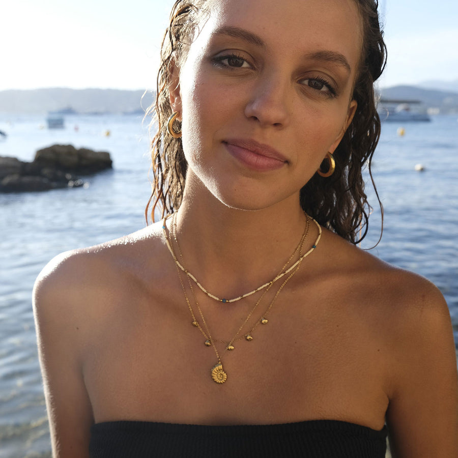 Gold necklace with small gold shells