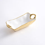 White porcelain rectangular shaped dish with handles and gold trim