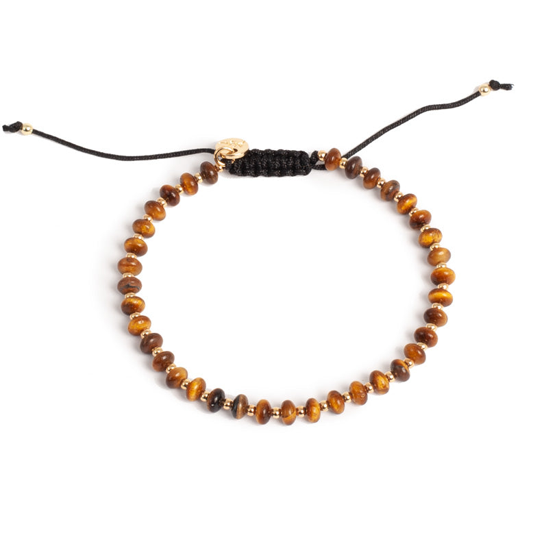 Tigereye bracelet with gold beads and black cord macrame clasp.