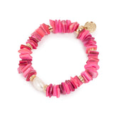 Pink shell and pearl bracelet with gold accents on a white background
