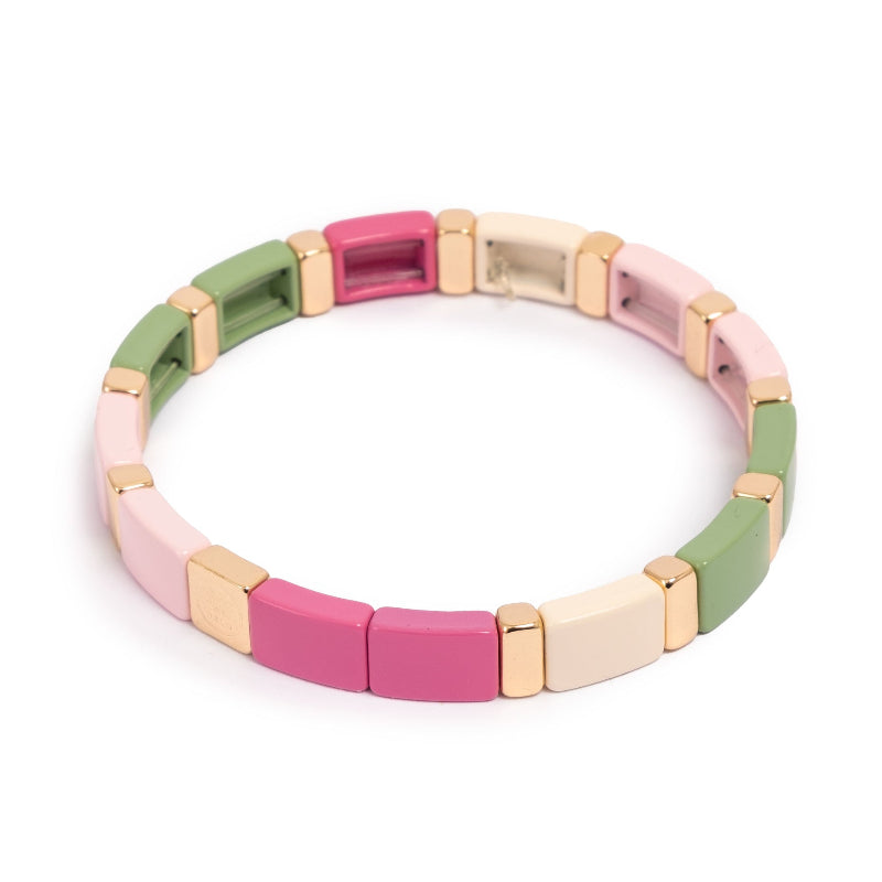 Colour ful bracelet in pink, green and natural enamel disks with gold bars.