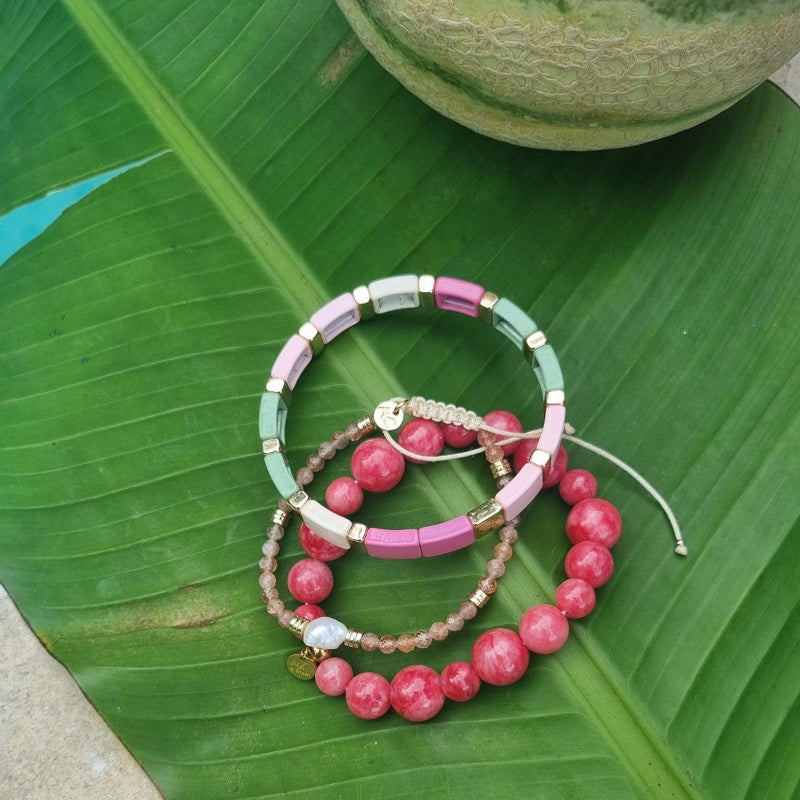 Colour ful bracelet in pink, green and natural enamel disks with gold bars.