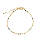 Bracelet with gold chain and multicolored beads on a white background