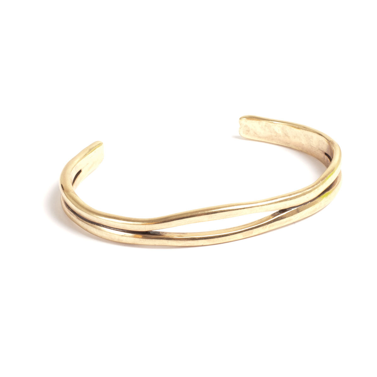 Gold bangle on a white background